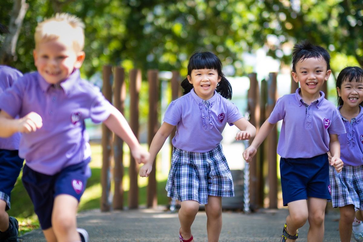 Children playing together joyfully outdoors at Cherie Hearts Nurtureloft